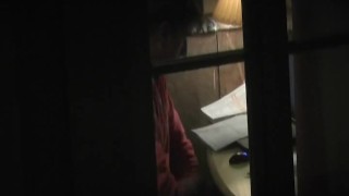 Hot stud caught masturbating in front of a window