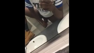 Dude jacking off in public bathroom