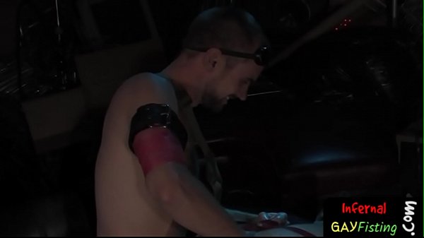 Hot gay stud digs his arm into ass deep