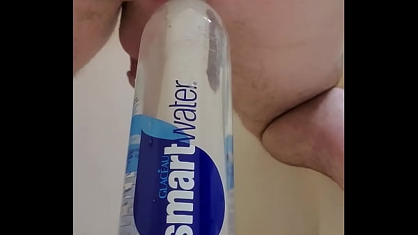 Soldier sitting on a bottle to stretch his slutty hole